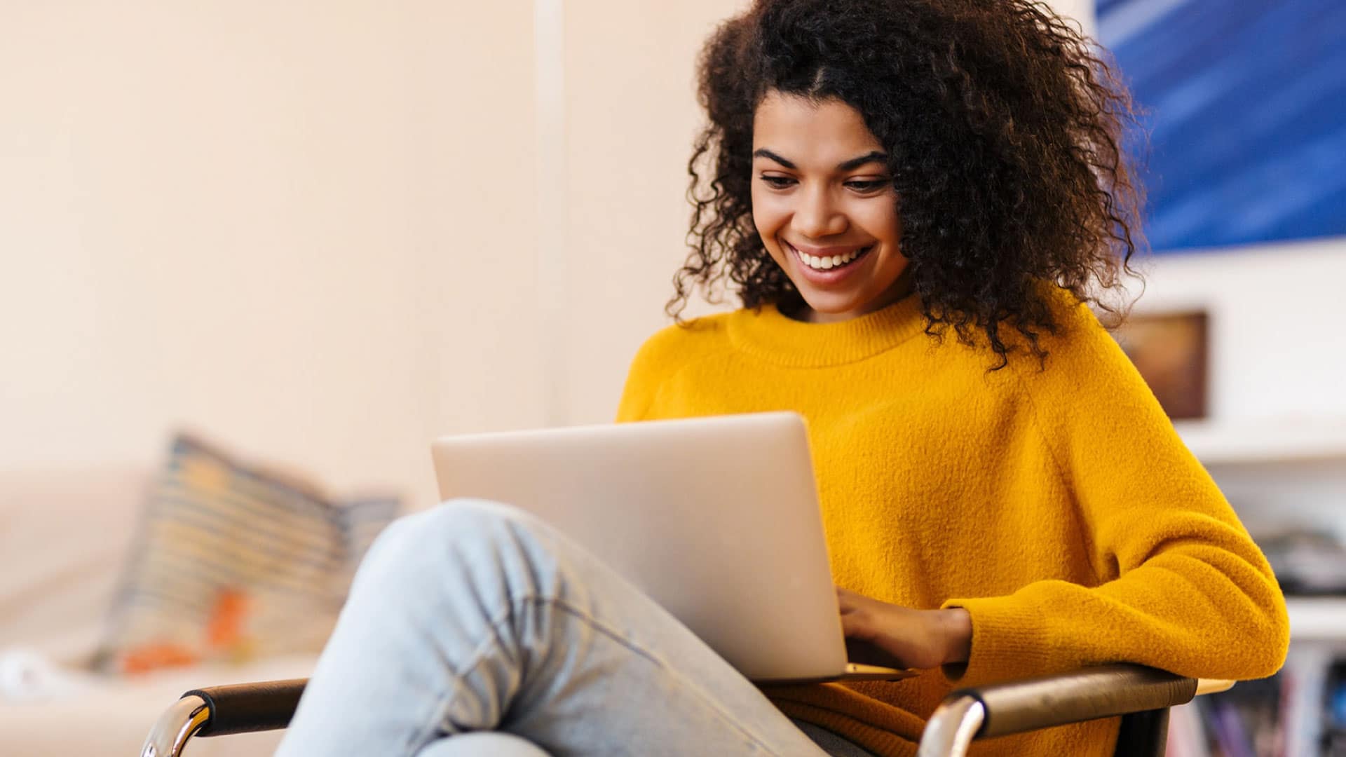 Happy woman looking at a computer, exemplifying the art of Content Repurposing to maximize engagement