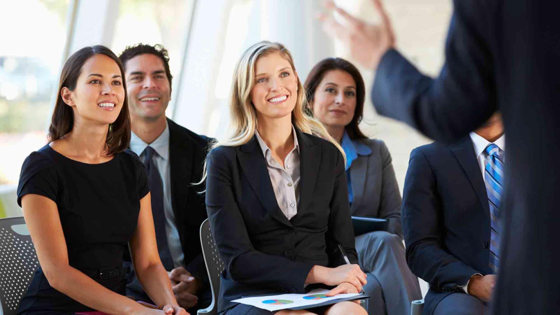 Boost Contact Center Performance - people engaged in a training session, showcasing agent training programs.